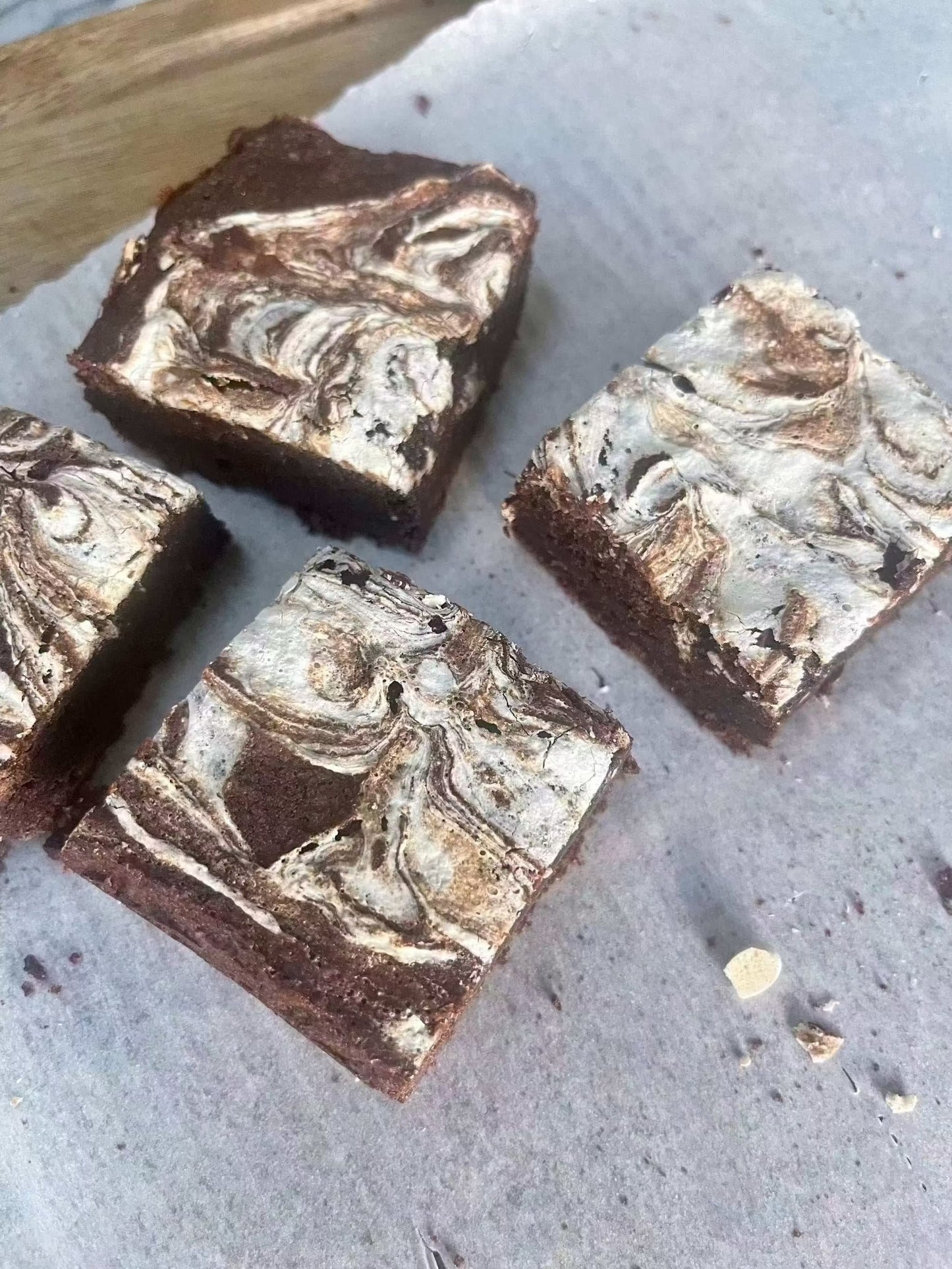 Marshmallow swirl brownie with gooey texture and white ghost design on top