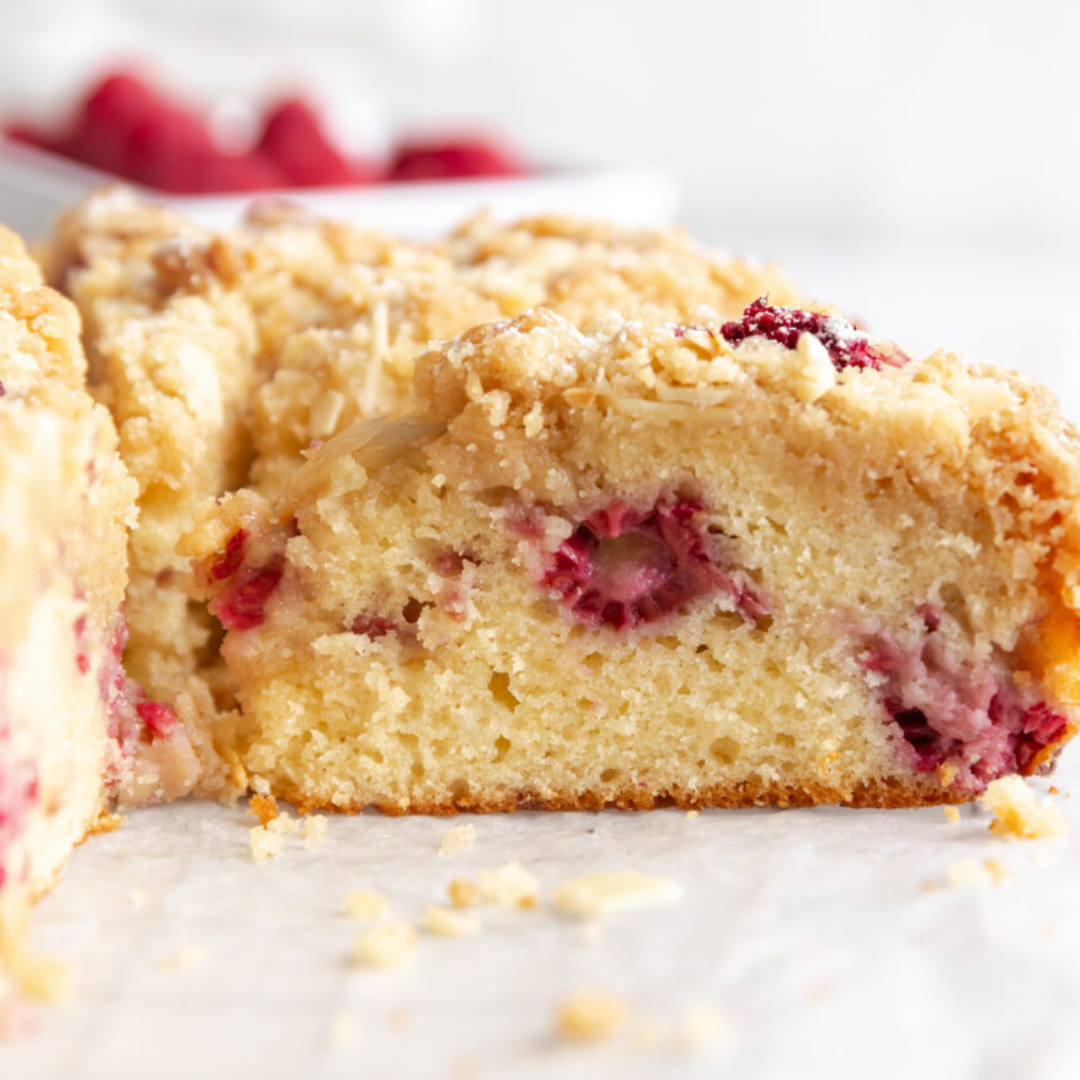 Raspberry almond coffee cake with crumb topping and fresh raspberries