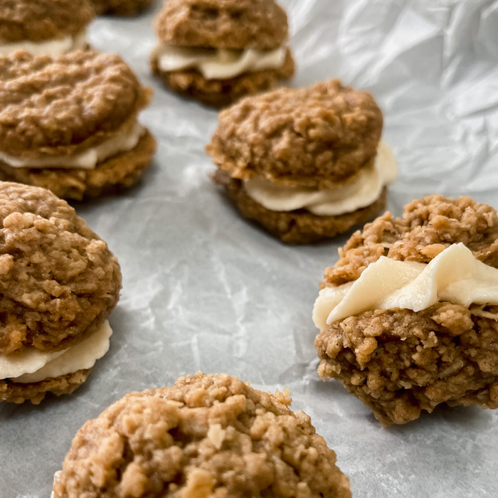 Close-up of oatmeal cookie sandwich with salted maple filling from Thanksgiving Treat Feast dessert box