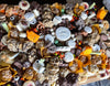 Halloween Dessert Board with assorted spooky cookies, brownies, cakes, and seasonal treats on a wooden platter