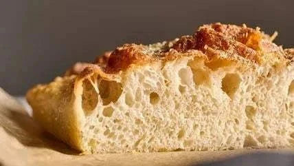 Cacio e Pepe Focaccia with black pepper and Pecorino cheese slices