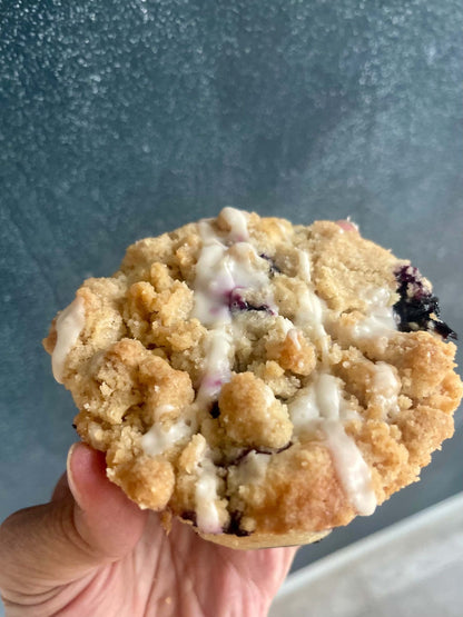 Blueberry Cardamom Coffee Cake with streusel topping and tender crumb in four large pieces