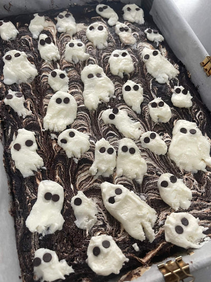 Spooky marshmallow swirl brownie with gooey texture and white swirl on top