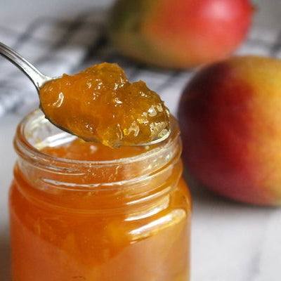 Jar of mango jam made with fresh mangoes