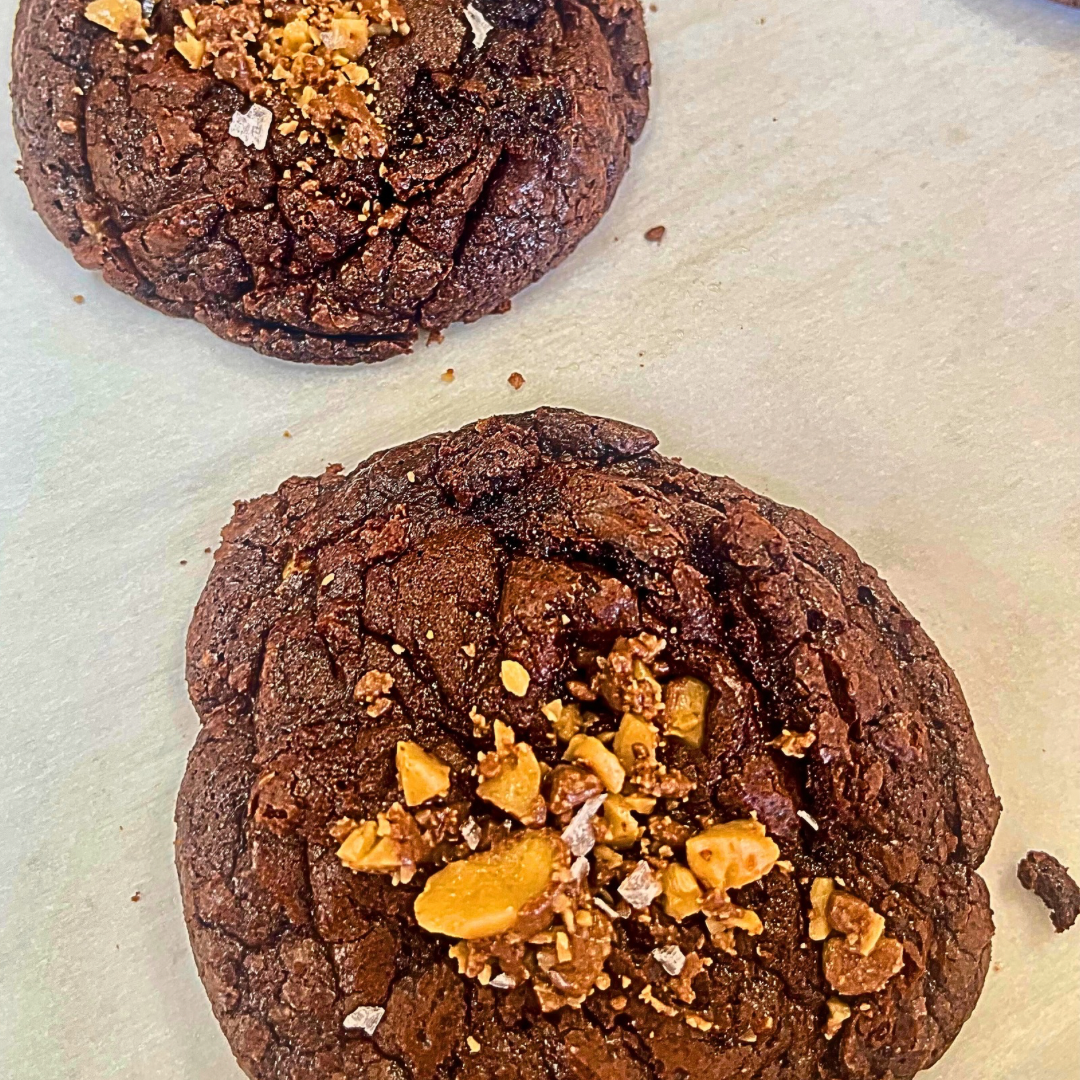 Salted fudgy toffee cookie with brownie base, crunchy toffee layer, and flaky salt in a box of six