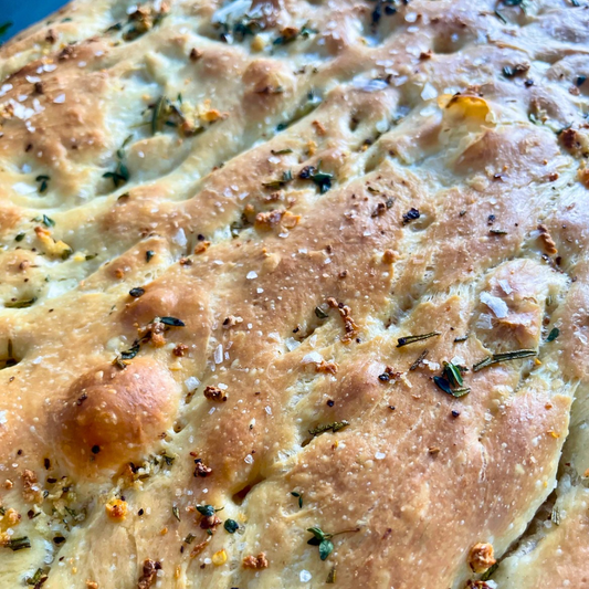Garlic Herb Focaccia bread with bubbly texture and herbs
