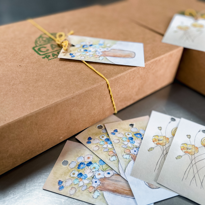 gift wrapped cookie package with hand illustrated gift tag